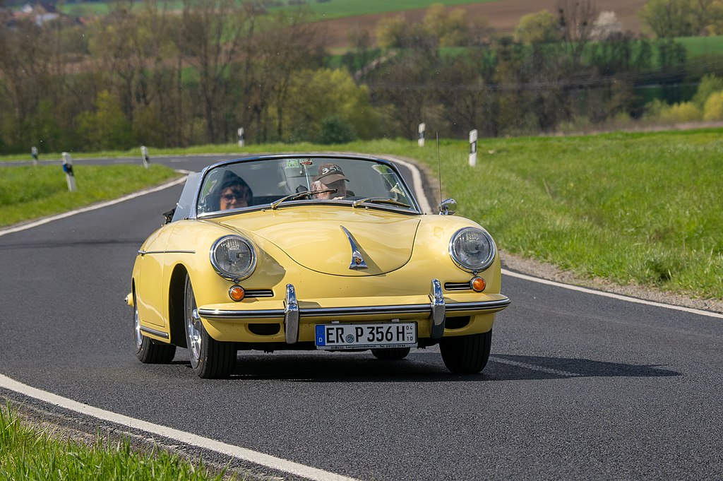 Porsche 356 driving on the street