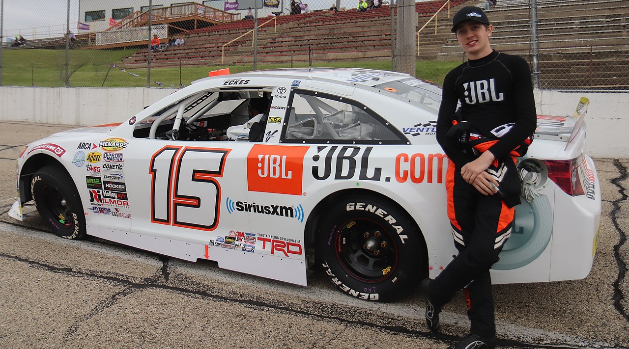 Christian Eckes stands beside the #15 Toyota Camry ARCA car at Madison.