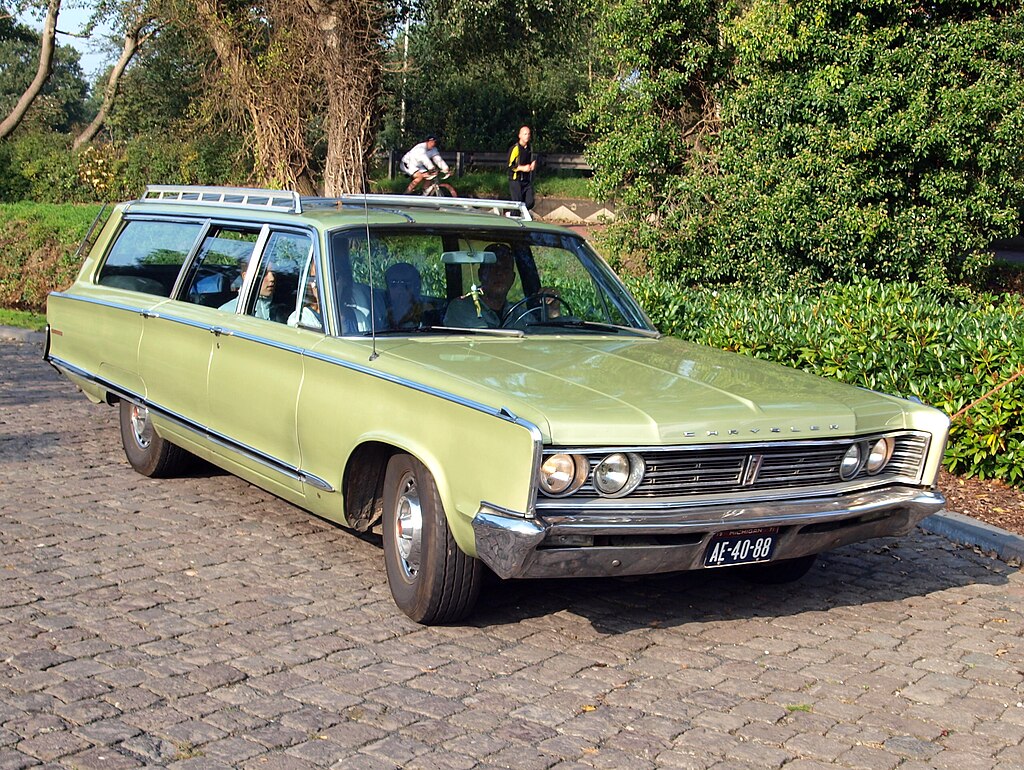 A close-up photo of a Chrysler Town & Country car parked in a parking lot
