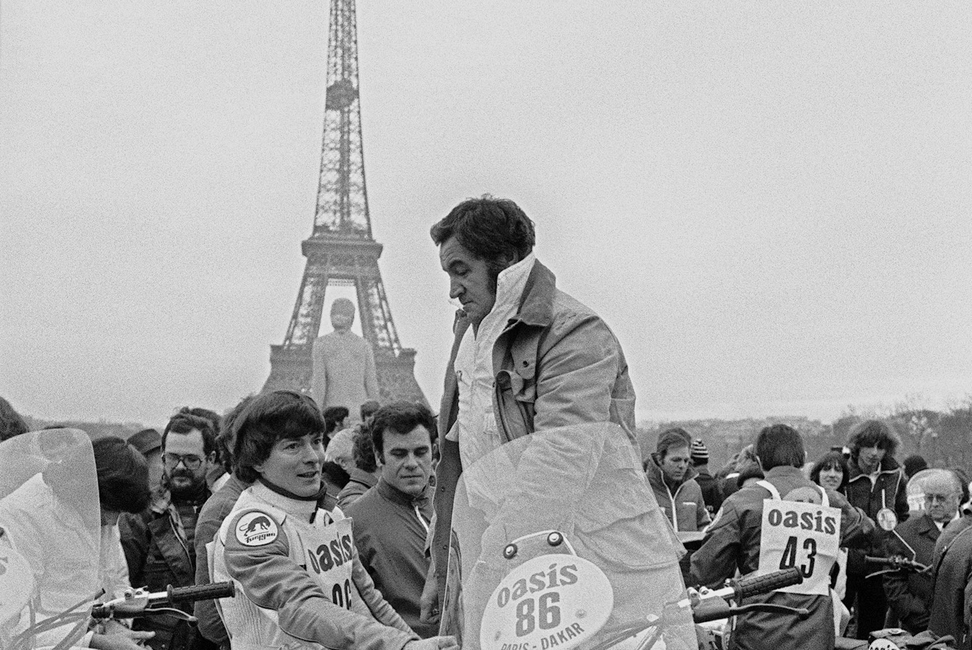 Rally men competing in the 1980 edition of Paris-Dakar rally gather at Trocadero esplanade in front of the Eiffel tower