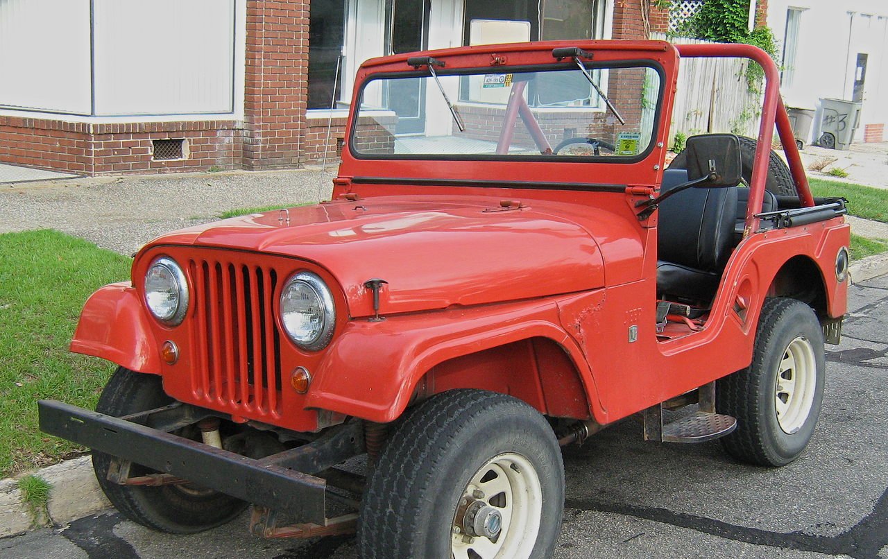 Jeep CJ-5 model with original V6 engine. Red open body.
