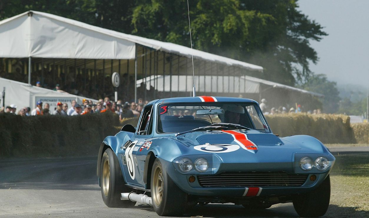 GOODWOOD, ENGLAND - JULY 12: Richard Attwood in action in a 1963 Chevrolet Corvette Grand Sport during the Goodwood Festival of Speed at Goodwood House on July 12, 2003 in Chichester, England.