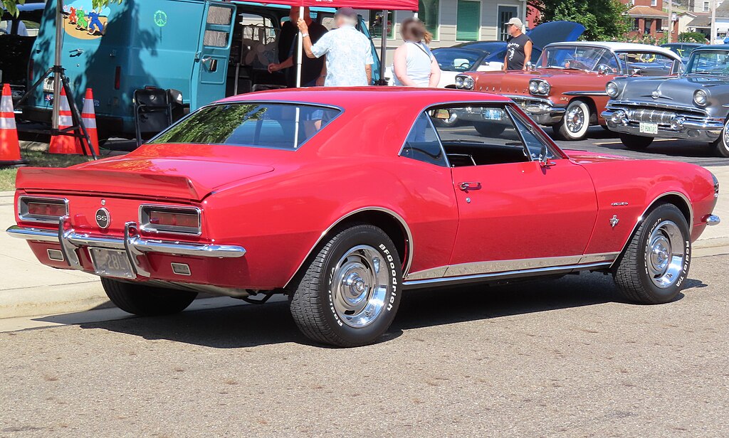 A close-up photo of a Chevrolet Camaro car parked in a parking lot
