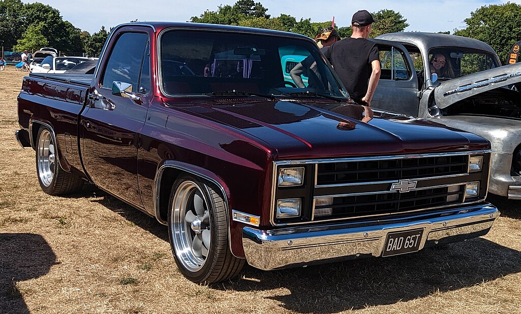 A close-up photo of a Chevrolet C/K car parked in a parking lot