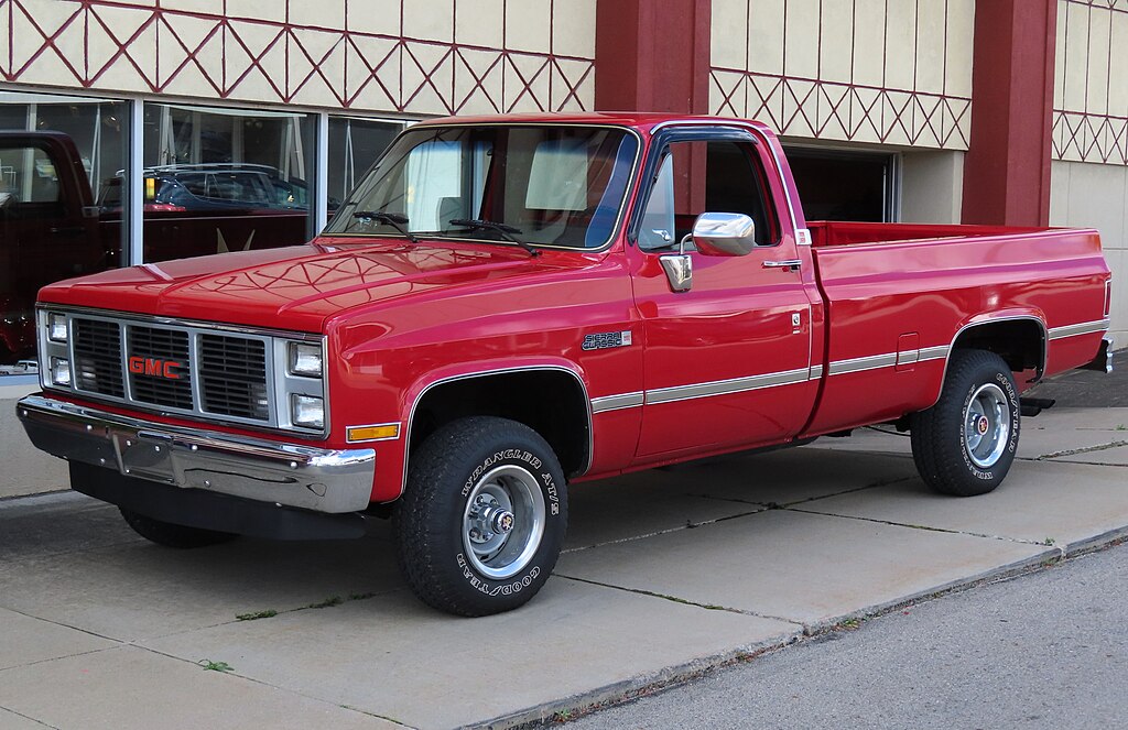 A close-up photo of a Chevrolet C/K car parked in a parking lot