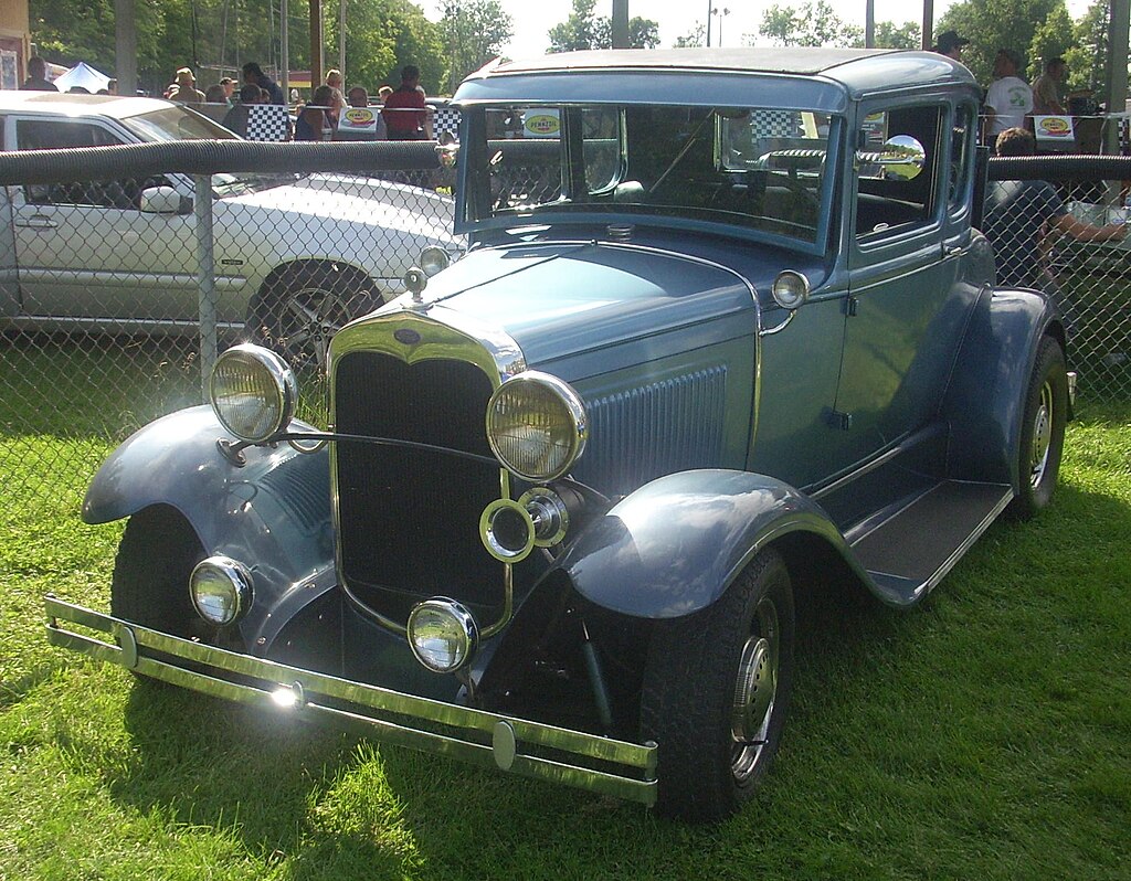 A close-up photo of a Ford Model A car on display at an exhibition