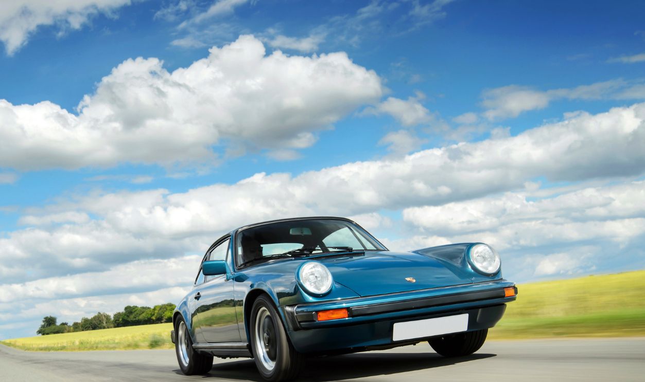 A 1978 Porsche 911 SC photographed driving on a track in Essex, on July 2, 2019.