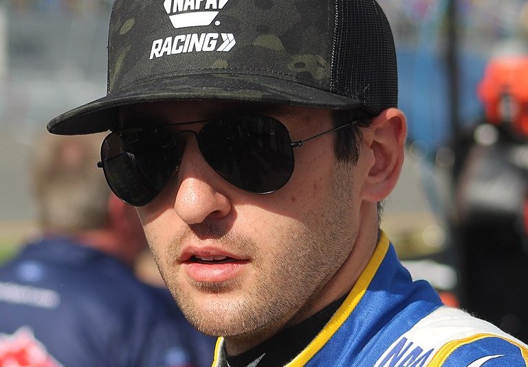 Chase Elliott wearing a pair of sunglasses and a cap