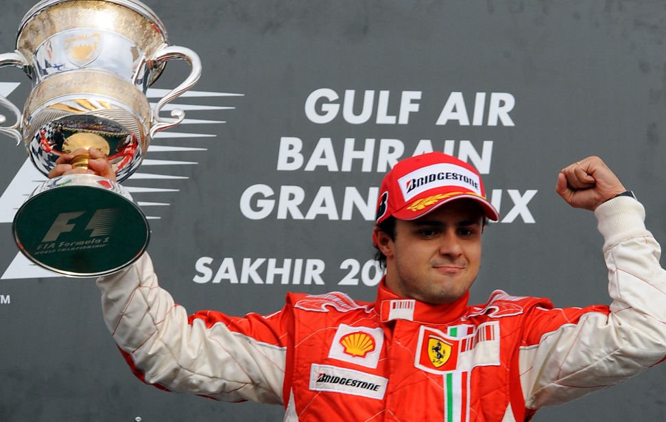 Ferrari Brazilian's driver Felipe Massa celebrates on the podium of the Sakhir racetrack