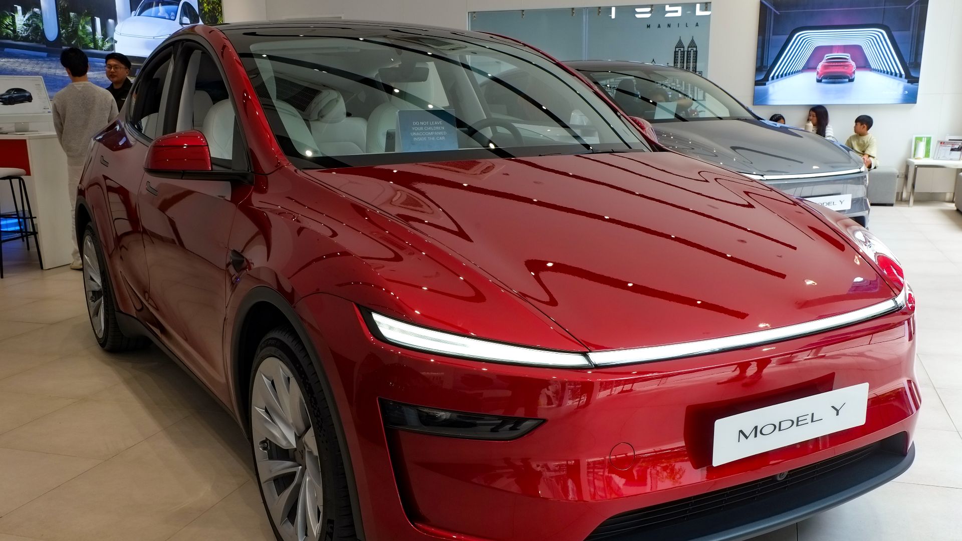 File:Tesla Model Y 2025 AWD Ultra Red - front.jpg