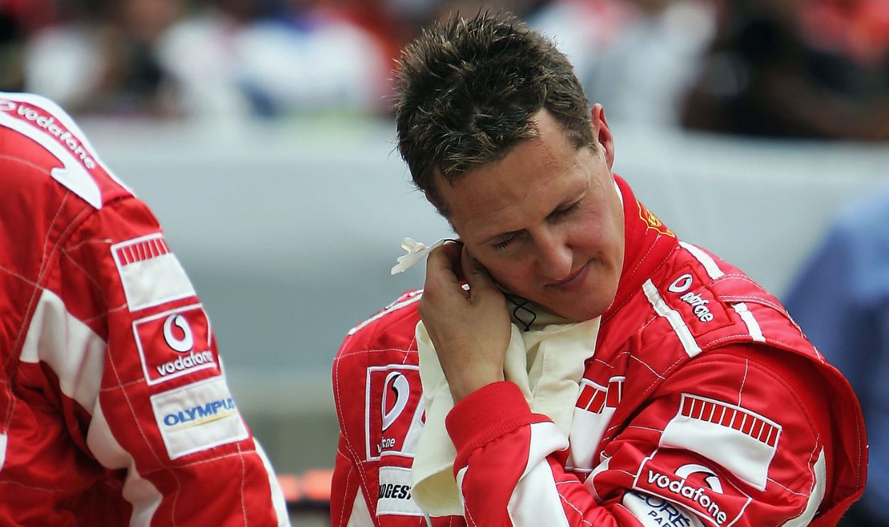 Michael Schumacher of Germany and Ferrari takes his balaclava off after he wins the United States F1 Grand Prix at the Indianapolis Motor Speedway on June 19, 2005 in Indianapolis, Indiana. Only six drivers eventually competed in the race after the teams failed to resolve the Michelin tyre safety row