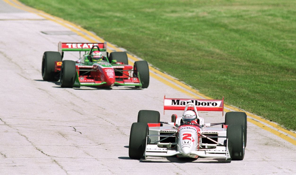Driver Gil de Ferran of Brazil who drives the Honda Reynard 2KI for Marlboro Penske Racing speeds around the track during the practice runs for the Marconi Grand Prix of Cleveland Presented by Firstar, part of the 2000 CART FedEx Championship Series at the Burke Lakefront Airport in Cleveland, Ohio