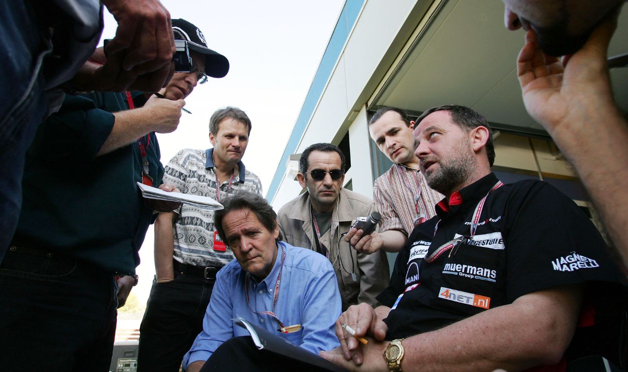  Minardi team driver Paul Stoddart (R) of Australia talks to the media in the paddock prior to the Australian Formula One Grand Prix at the Albert Park Circuit, on March 3, 2005 in Melbourne, Australia