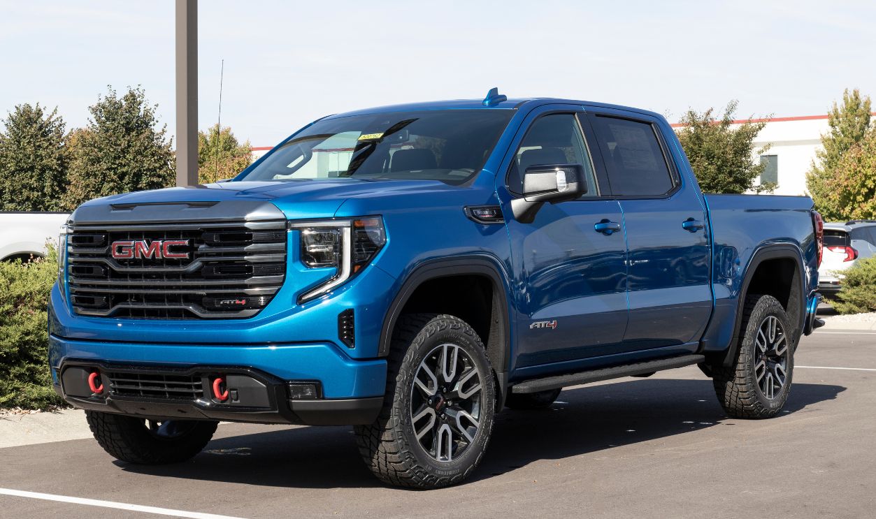 GMC Sierra 1500 pickup display at a dealership. GMC offers the Sierra in HD, HD Pro, AT4 and Denali models.