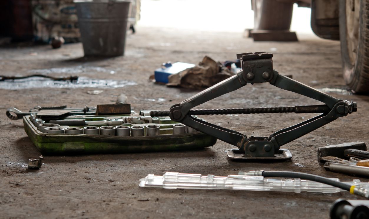 Auto parts - stock photo auto parts that include a car jack, lug wrench