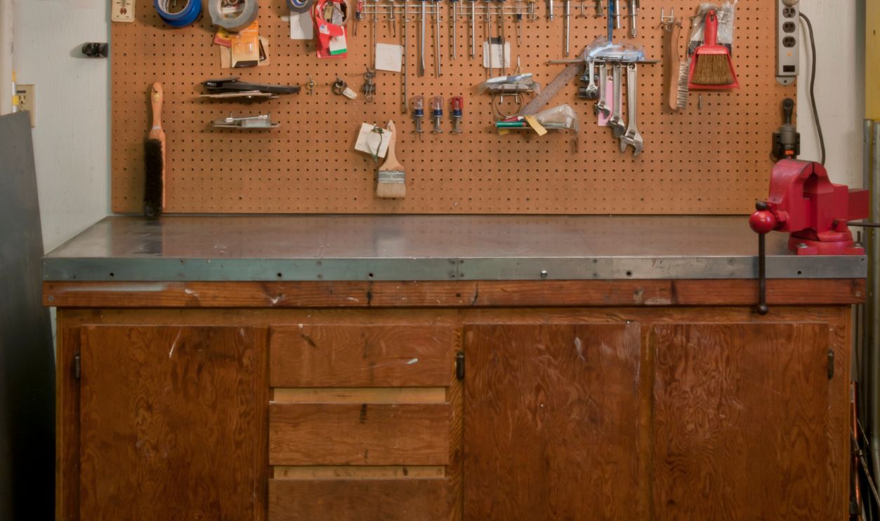 Garage Work Bench - stock photo Vertical photograph of my garage work bench by special request. (All visible logos have been removed from tools & packages.)I also have a horizontal version of this photo: