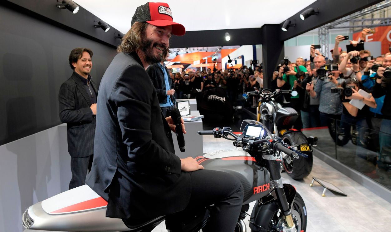 Canadian actor Keanu Reeves (C) speaks next to US producer Gard Hollinger (L) during the presentation of the new motorbike Arch 1s during the 2017 Milano Moto Show (EICMA l'Esposizione Internationale del Ciclo e Motociclo) on November 8, 2017 in Milan