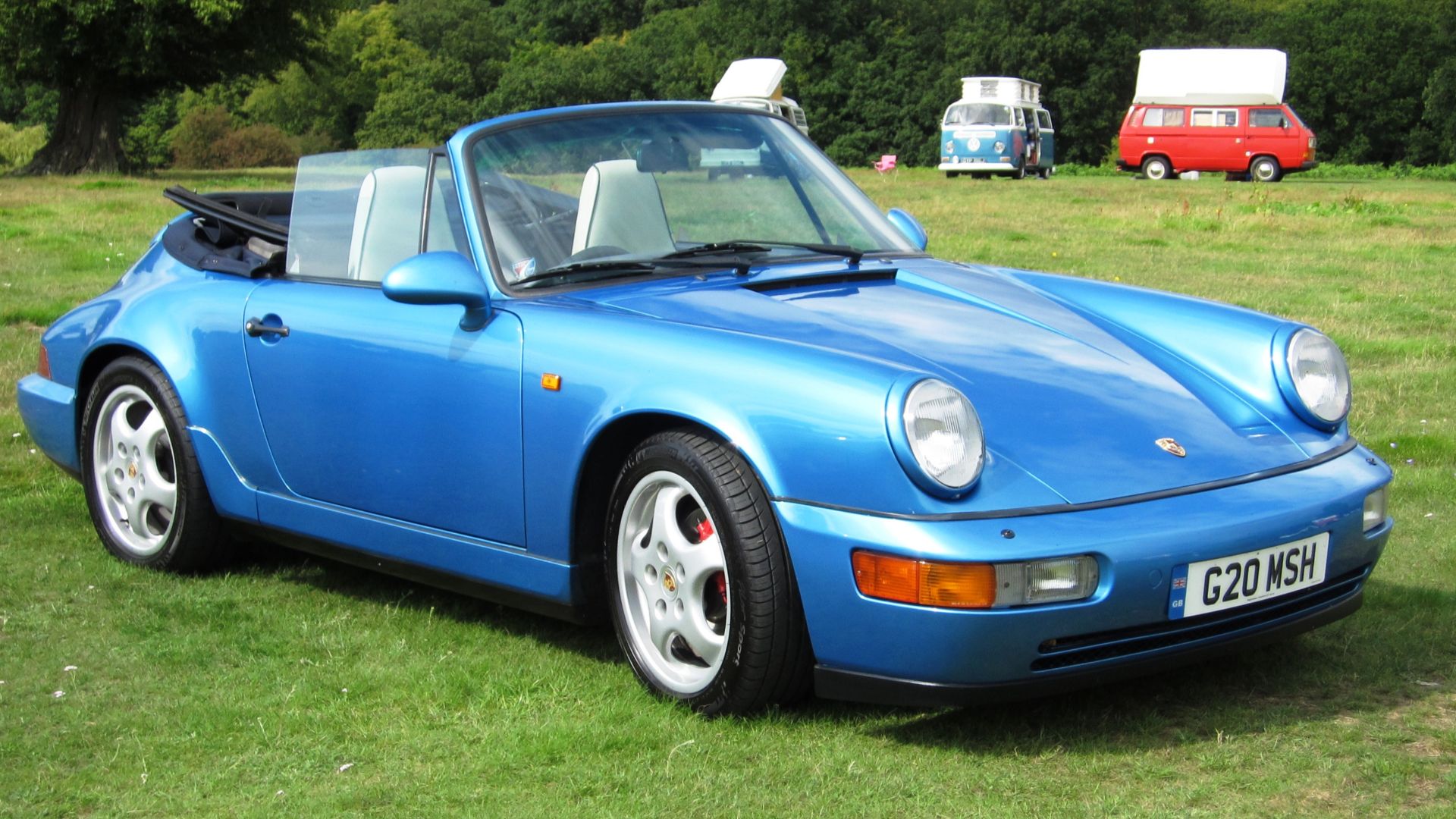 File:Porsche Carrera 4 cabriolet ca 1990 with herbivores dominating the background.jpg