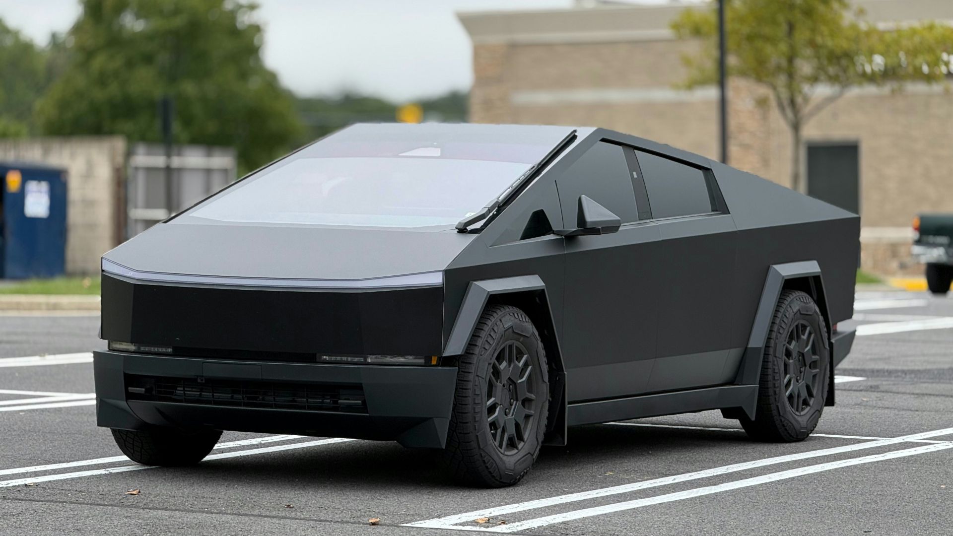 A futuristic car is parked in a parking lot