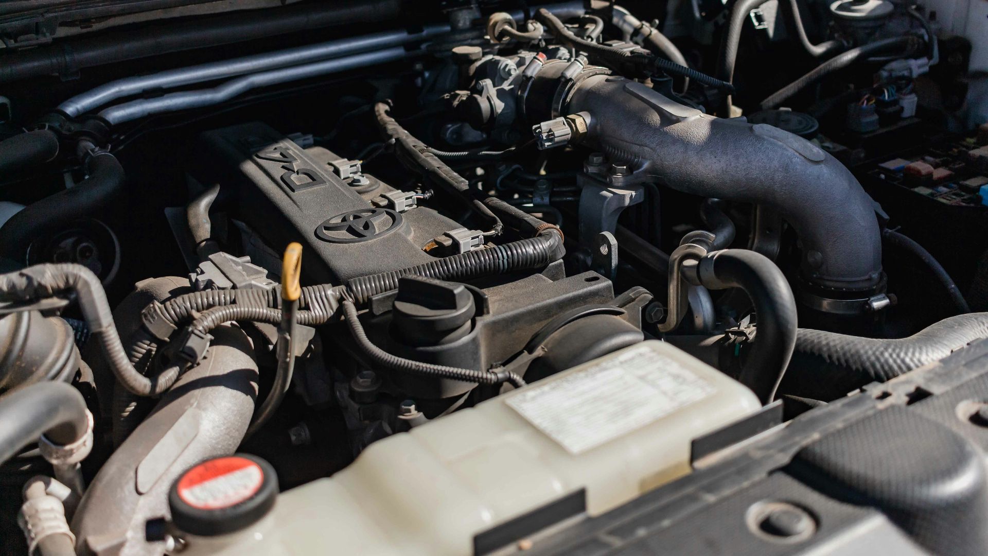 the engine compartment of a car with the hood open