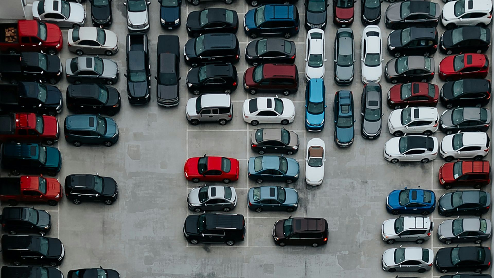 aerial photography of cars on parking lot
