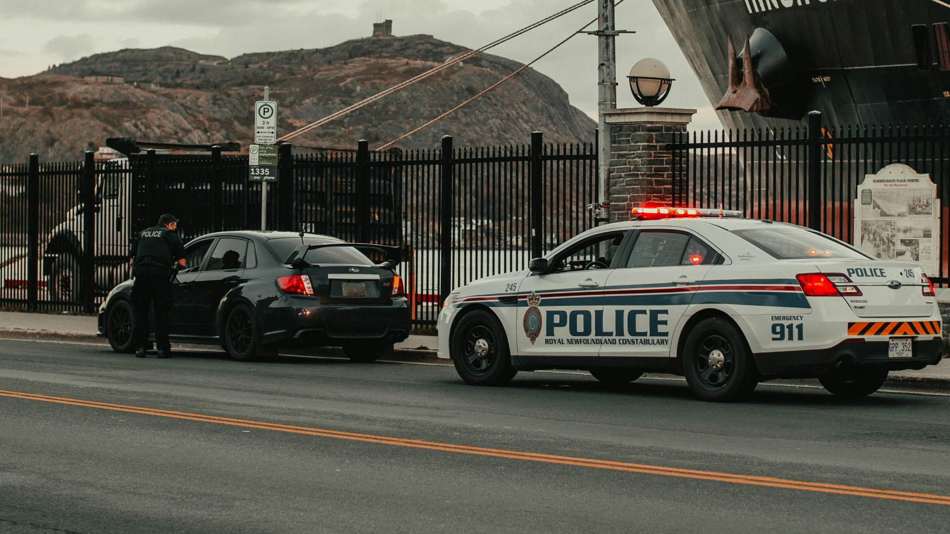 white and blue police car on road