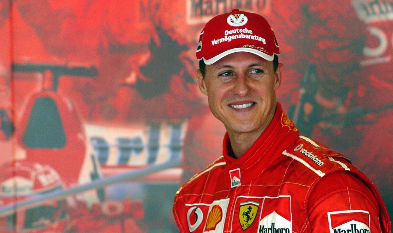 Formula One World Champion Michael Schumacher of Germany smiles in the Ferrari garage ahead on the eve of the first practice session of the 2005 Australian Formula One Grand Prix in Melbourne, 03 March 2005. Ferrari will be using their 2004 cars in the first race of the 2005 Formula One season. AFP PHOTO/Paul CROCK 