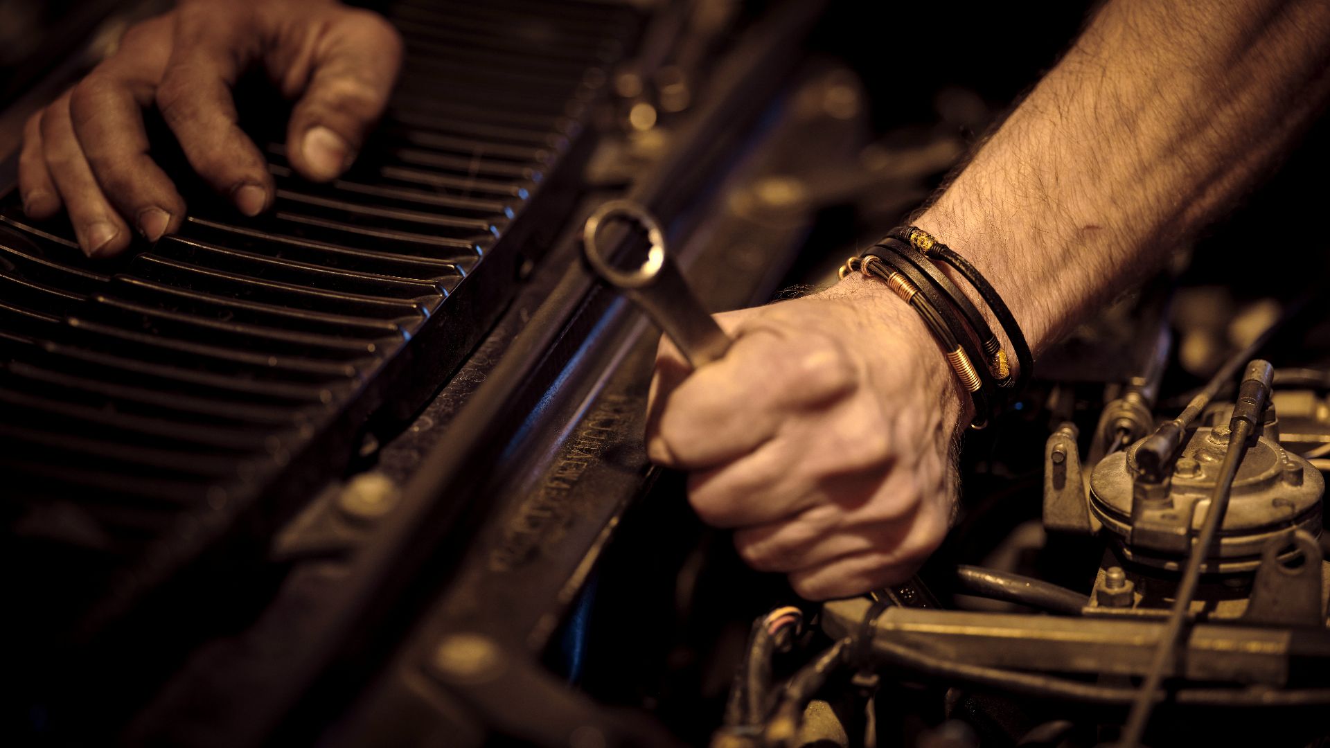 grayscale photo of person playing piano