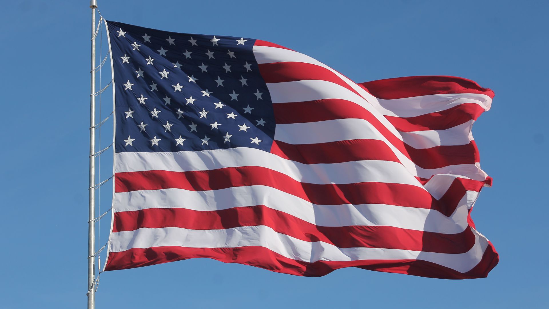 File:American Flag Waving on a Flag Pole.jpg