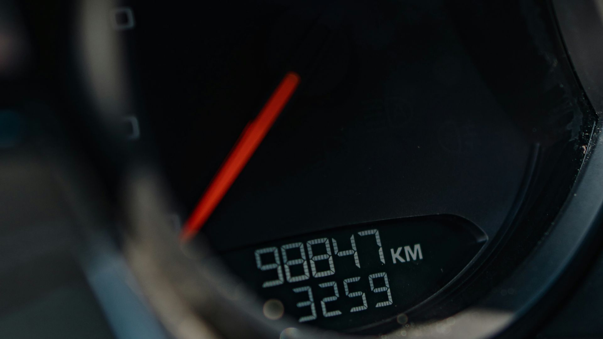 a close up of a speedometer on a motorcycle