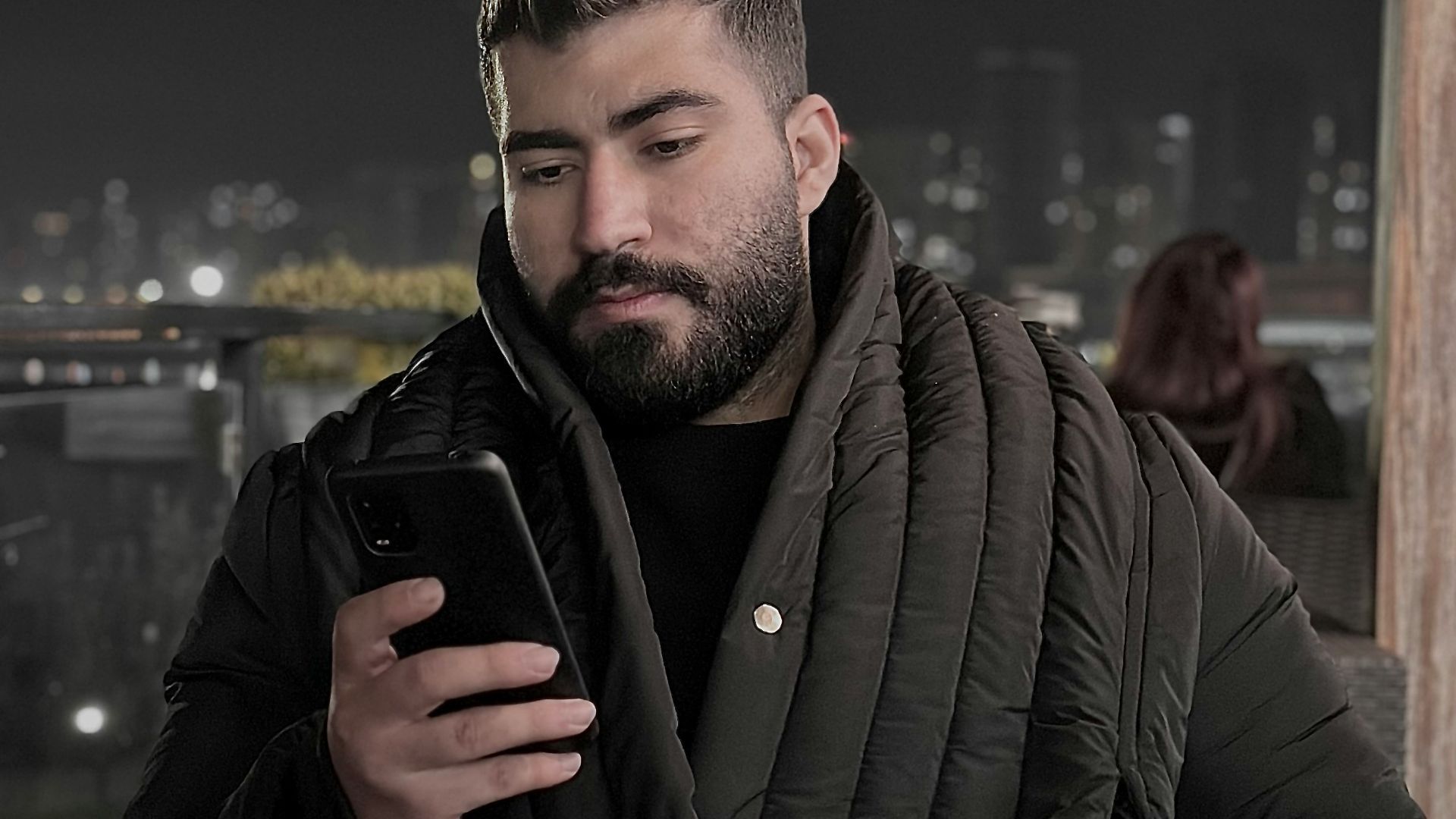 a man holding a phone