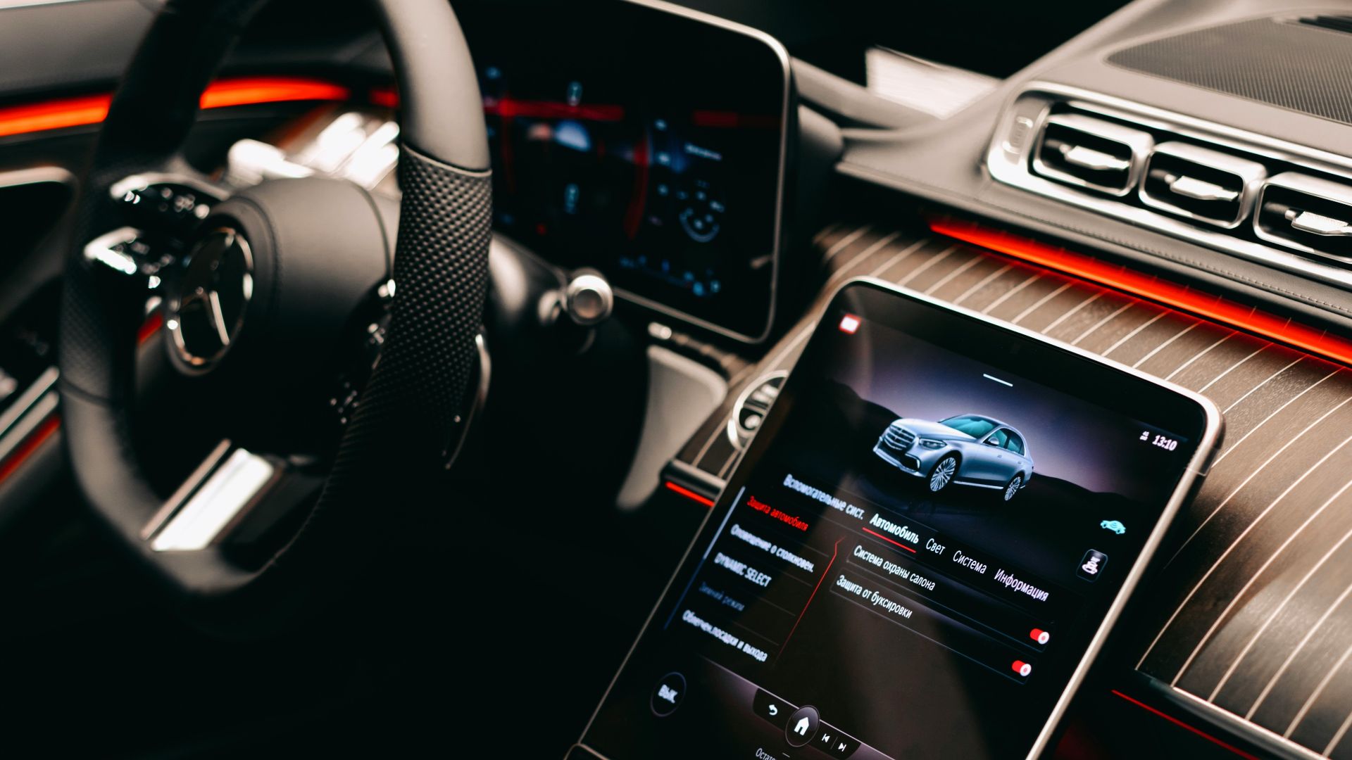a car dashboard with a cell phone in the center