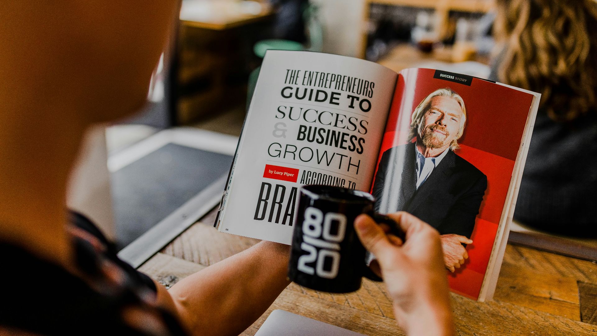 man reading magazine