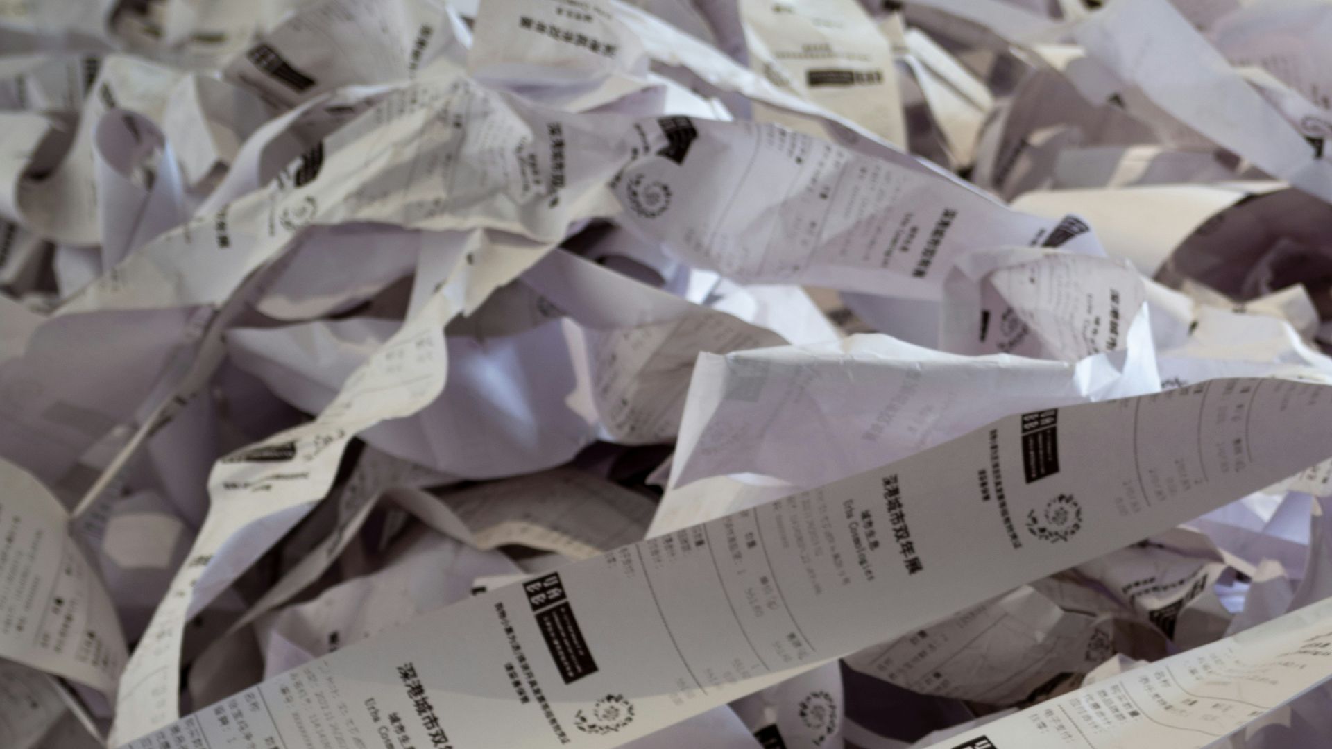 a pile of paper with a lot of papers on top of it