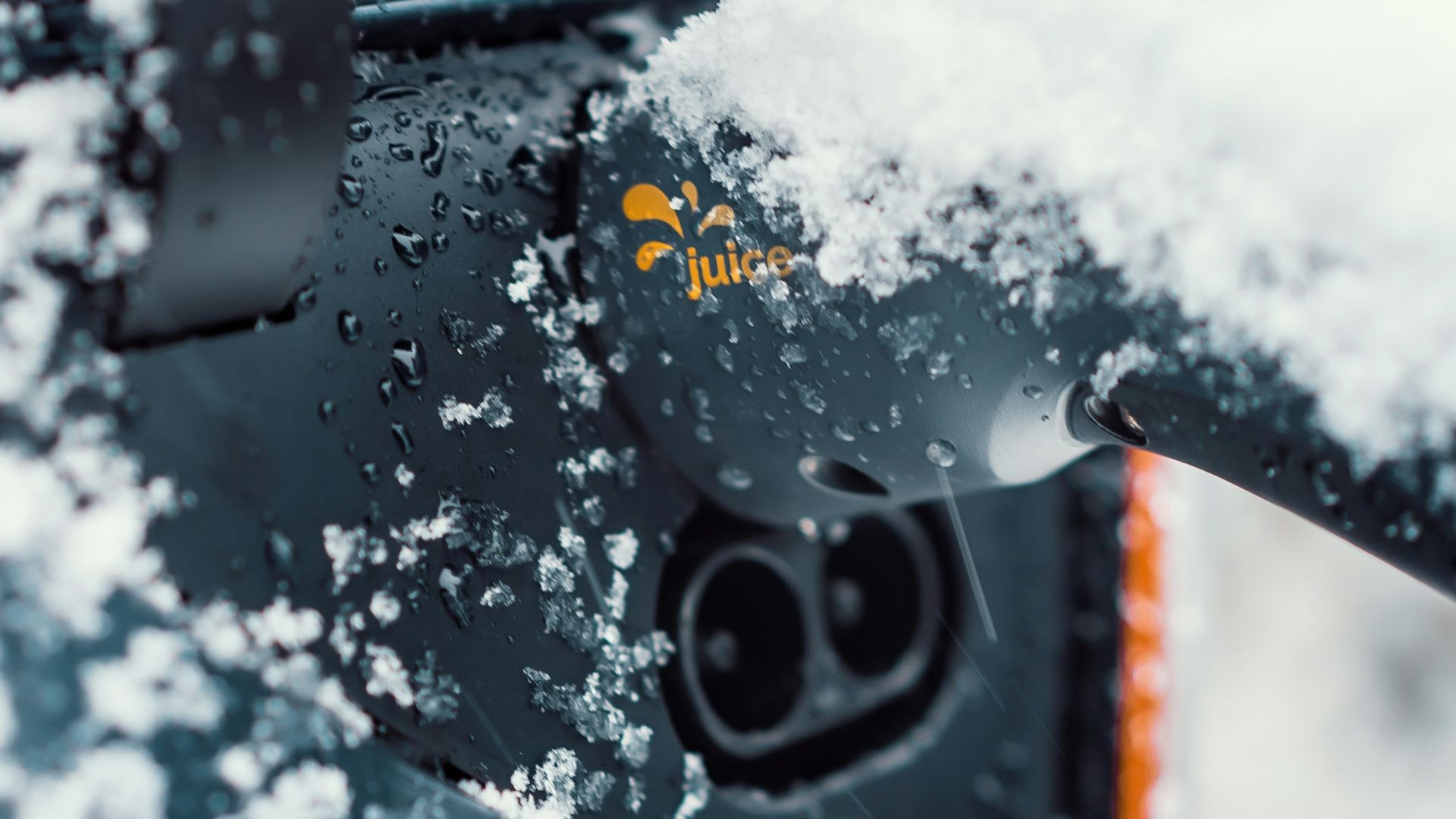 a close up of a car with snow on the windshield