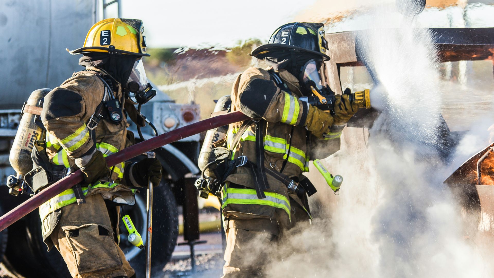 three fireman preventing fire during daytime