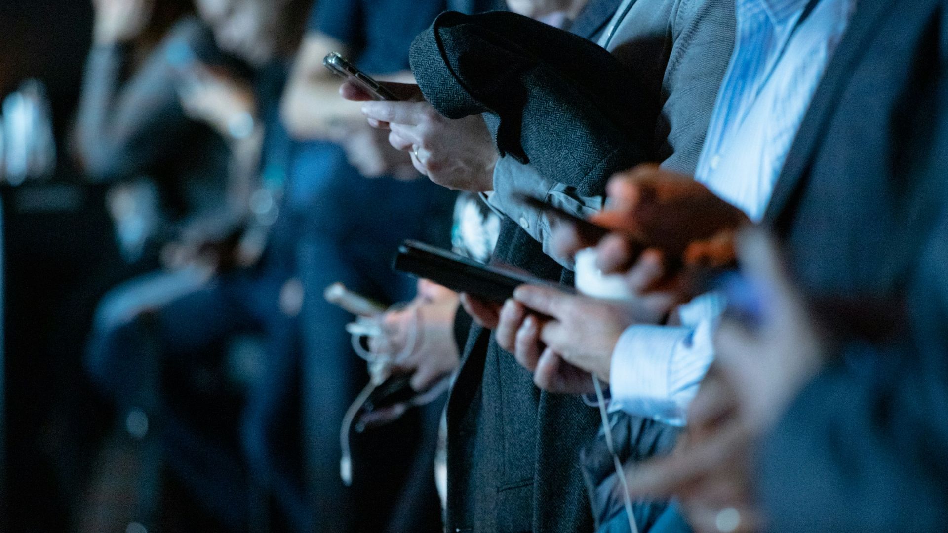 people using phone while standing
