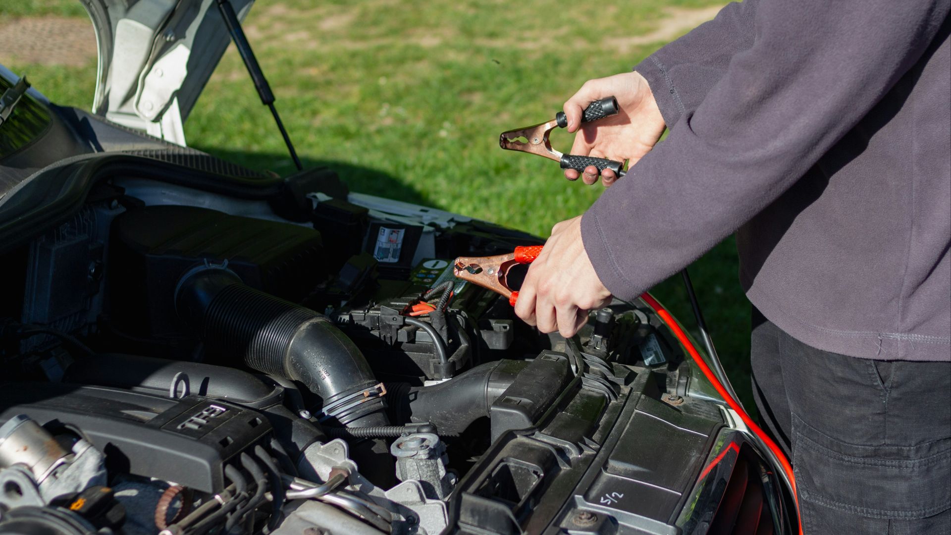 person in gray long sleeve shirt riding black motorcycle