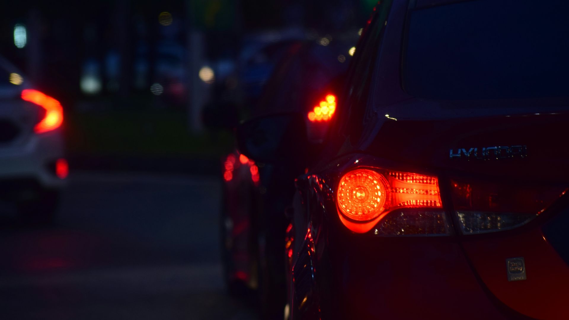 a couple of cars that are sitting in the street