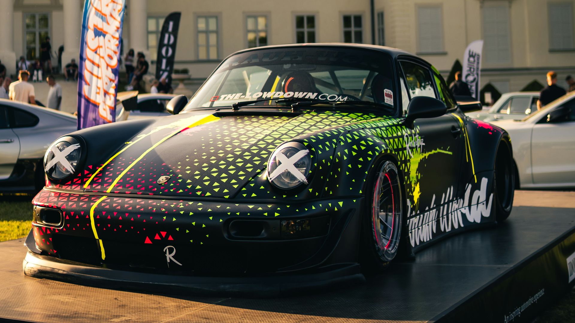 Customized black porsche on display at event