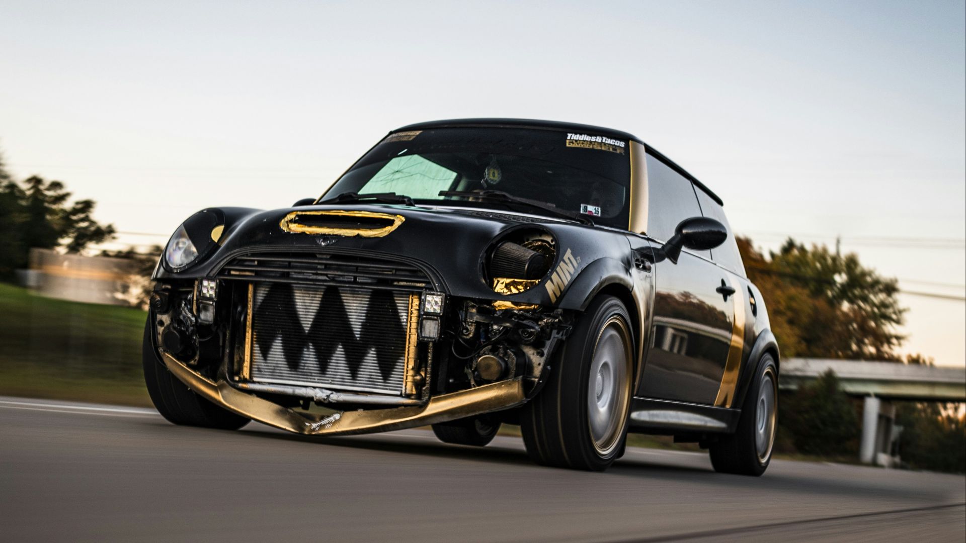 black and yellow porsche 911 on road during daytime