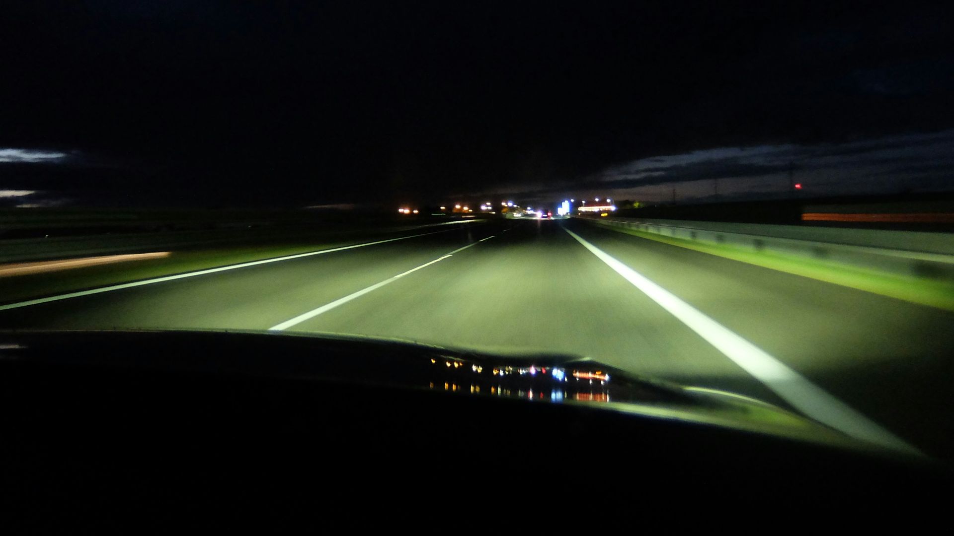 Driving on highway at night with headlights on