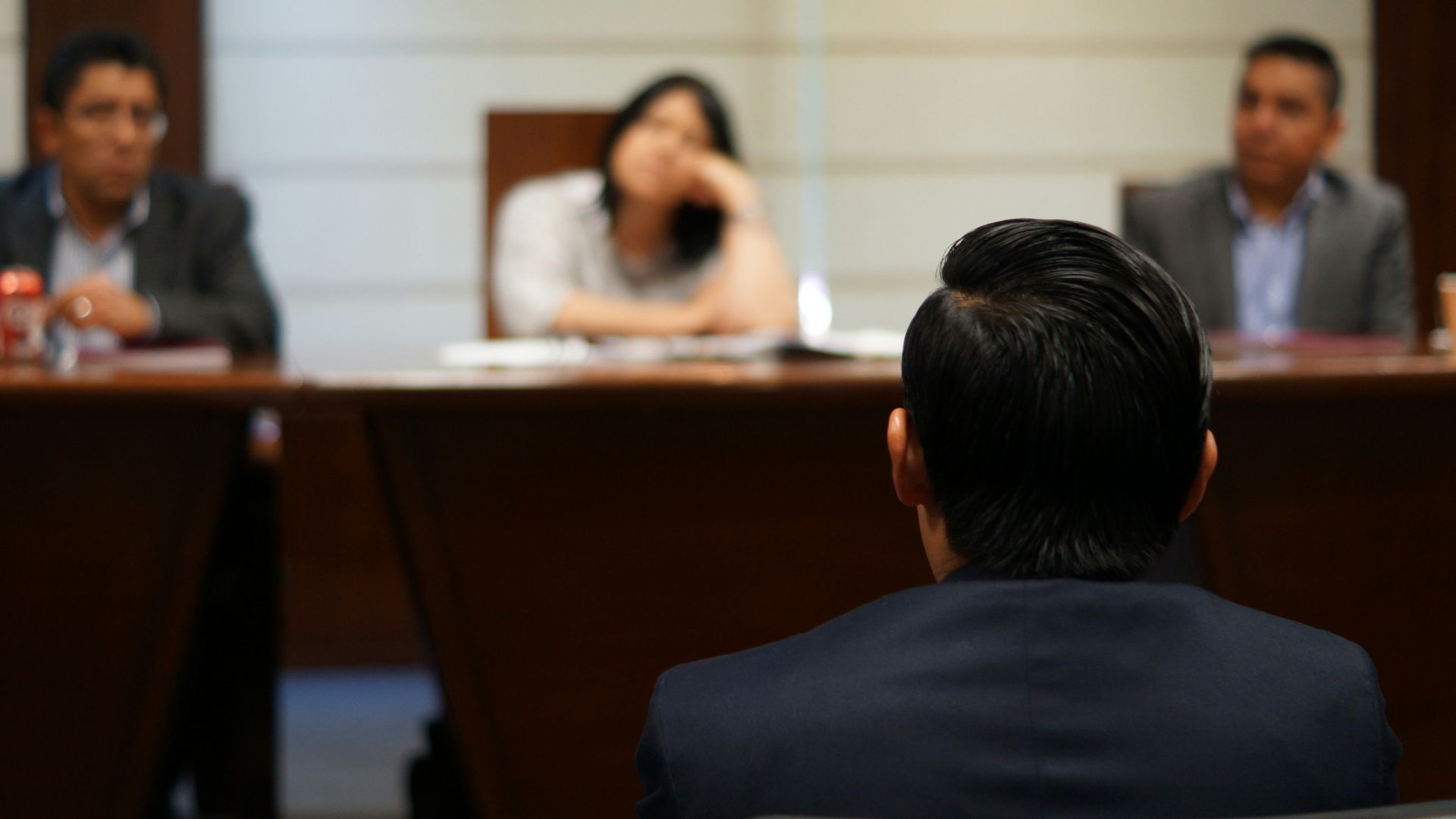 man in black shirt sitting beside woman in white shirt