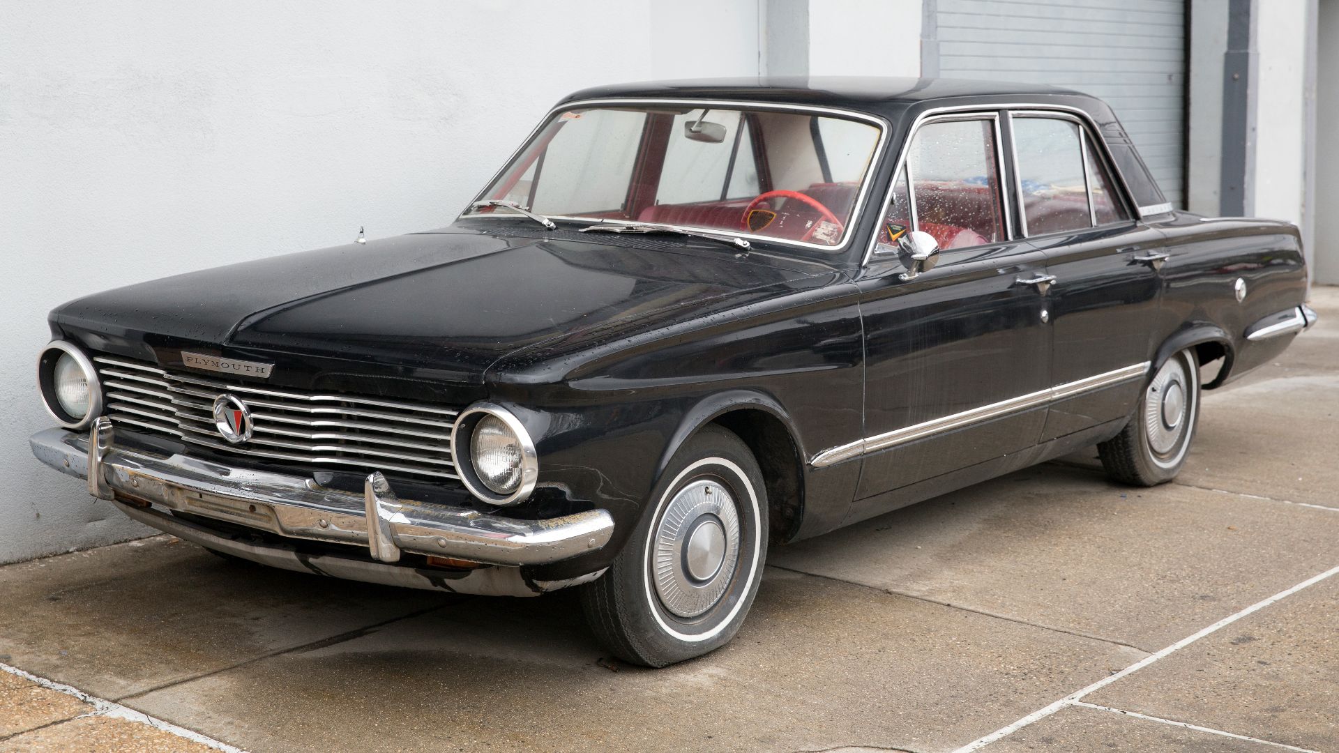File:1964 Plymouth Valiant 4-door sedan in Black, front left.jpg