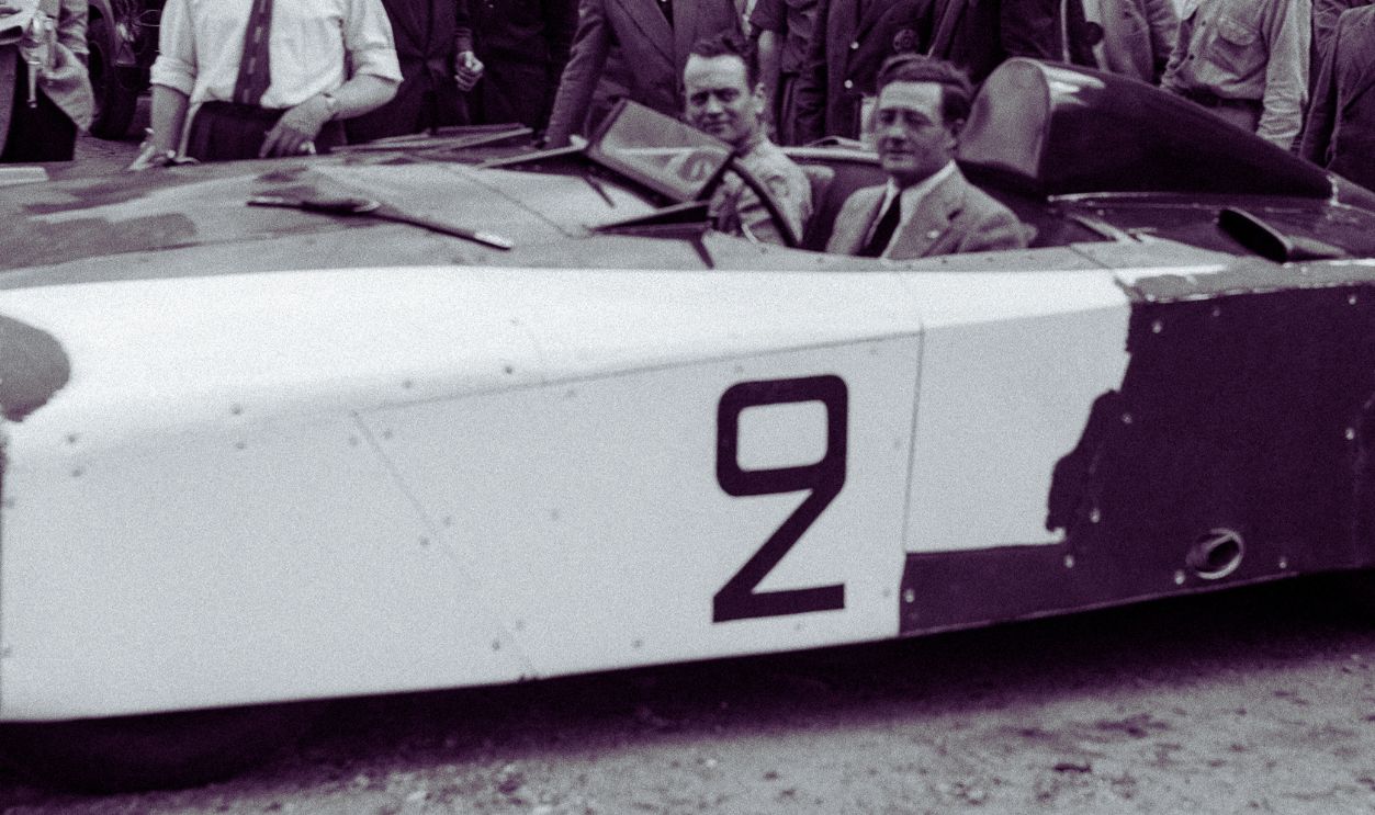 US drivers Briggs Cunningham (R) and Phil Walters (L) sit in the American Cadillac car n°2
