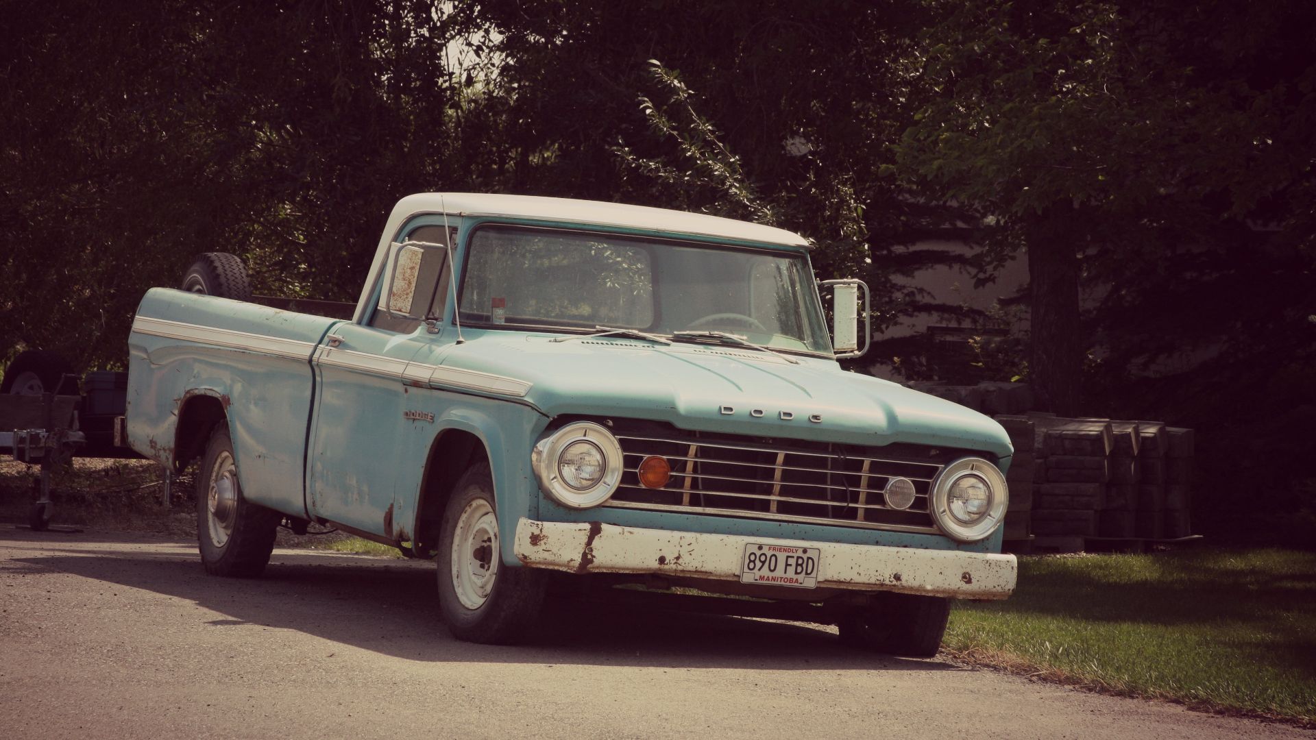 A classic Dodge D-Series pickup truck with the pie plate headlights.