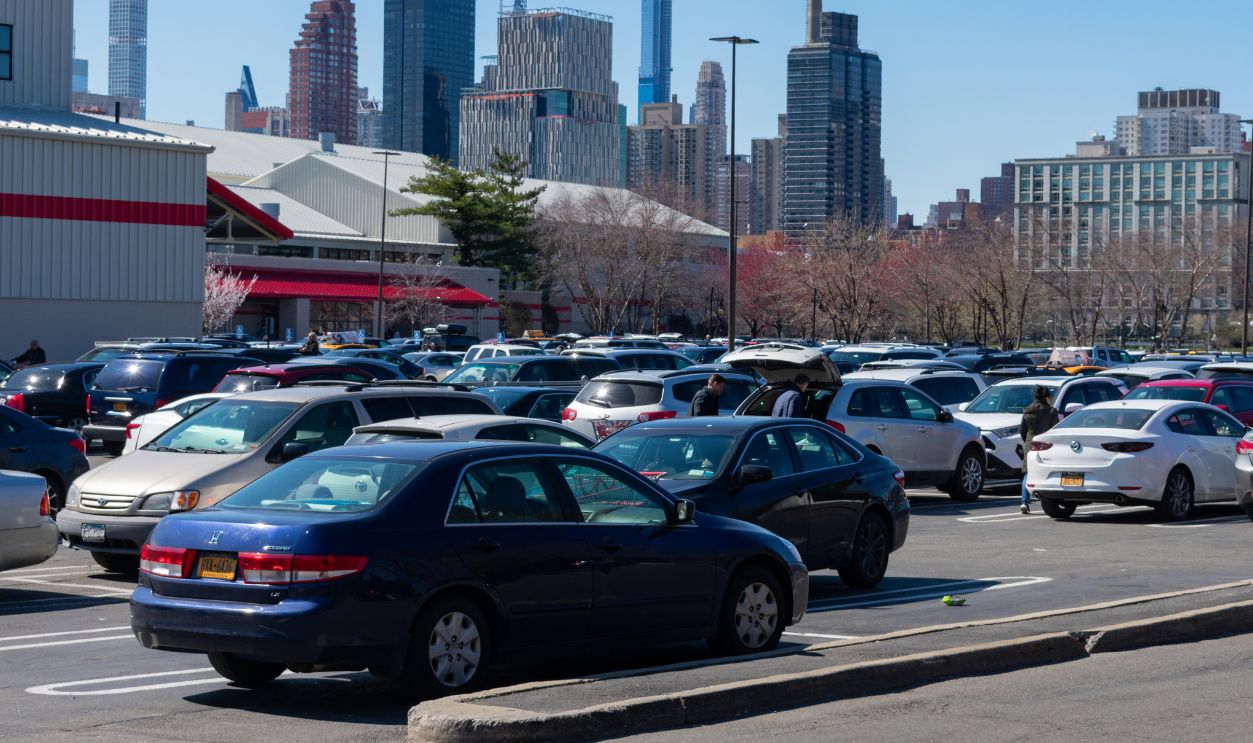 Astoria Queens, New York / USA - March 15 2020: Parking Lot filled with Cars and Panicked Shoppers at the Costco Wholesale Store in Astoria Queens of New York City during the Coronavirus Outbreak