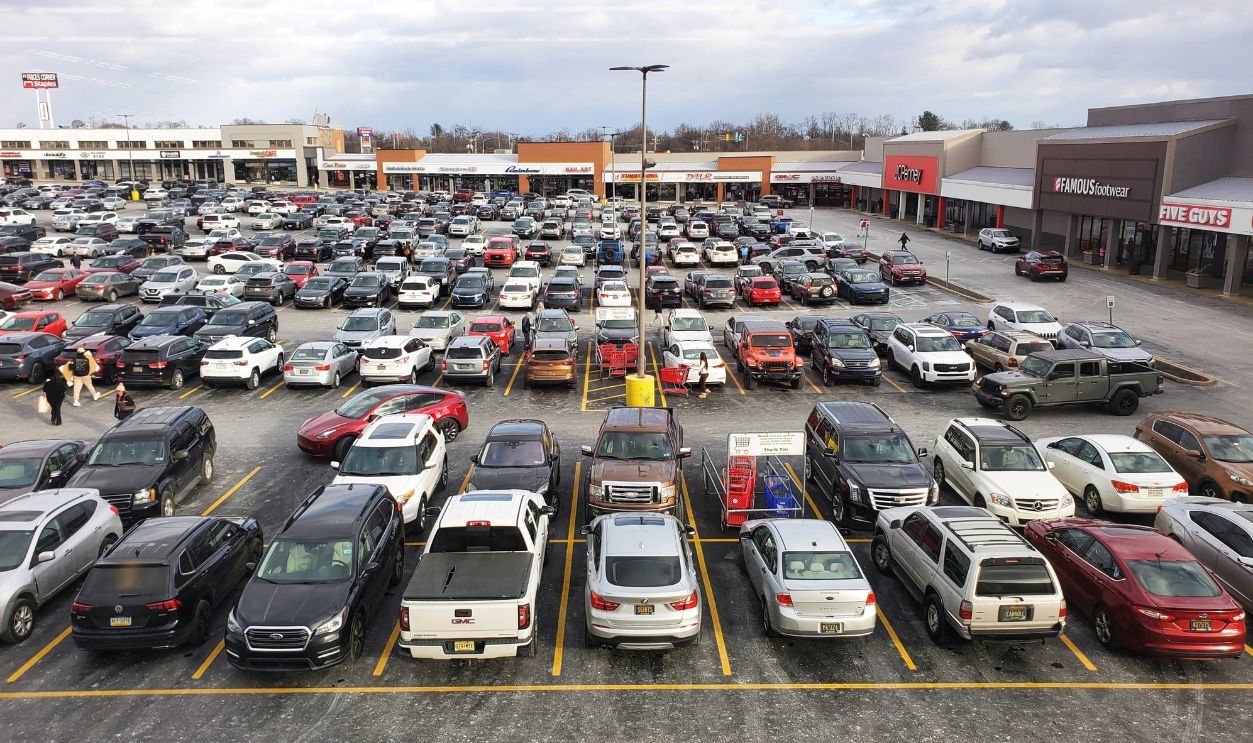 Wilmington, Delaware, U.S.A - January 4, 2025 - Full parking lot at a Pike Creek Shopping Center on a day with overcast skies.