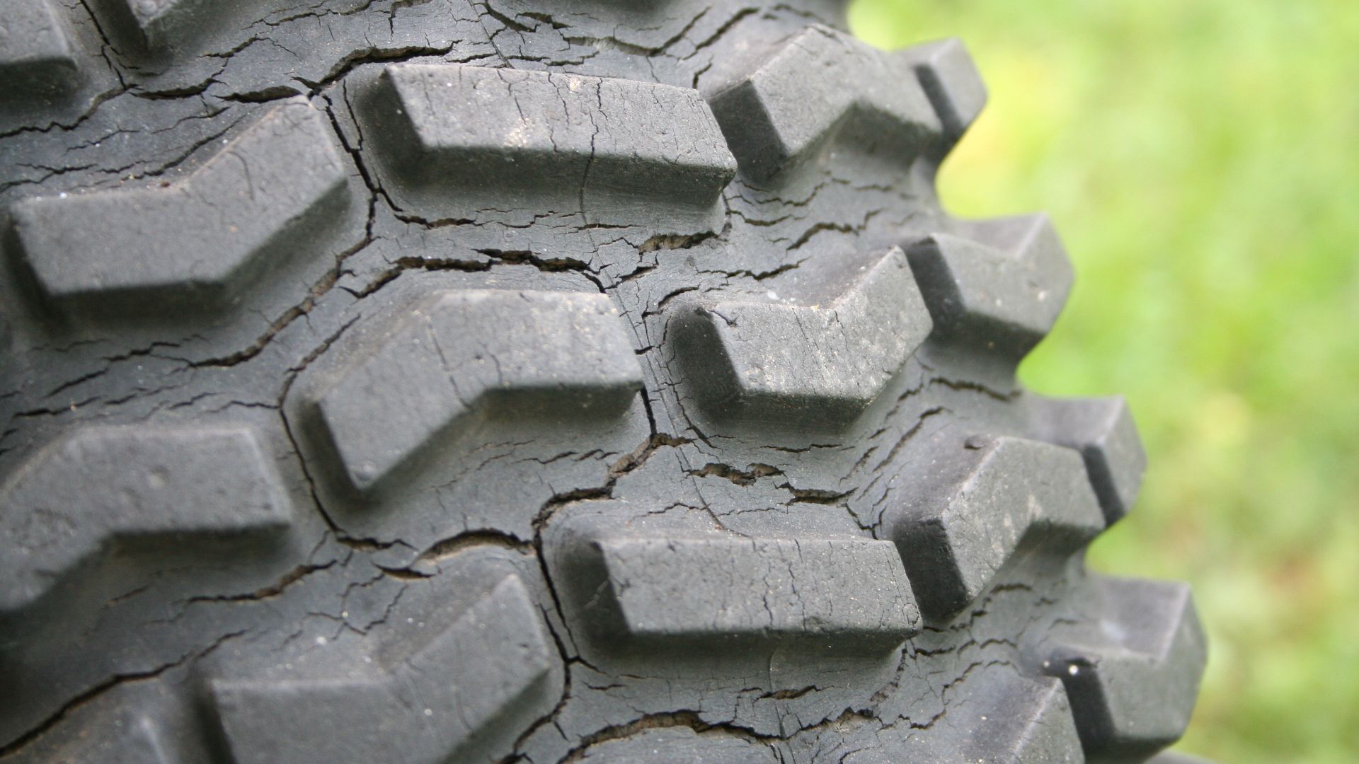 Tire showing weather-cracking over long-term exposure to the weather.