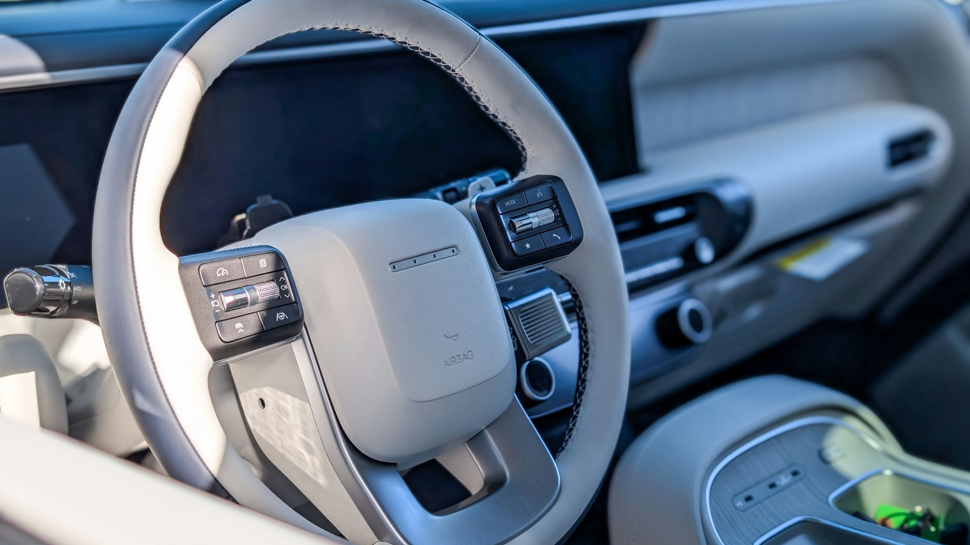 Modern car interior with steering wheel and dashboard